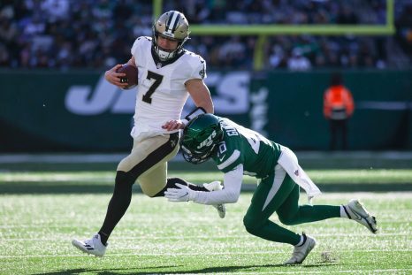 American football players battle for the ball during a game