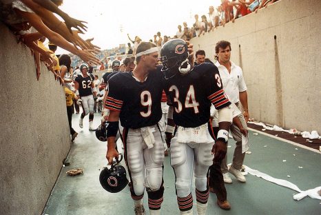 American football teams leave the field after the game