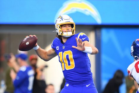 American football player looks to pass during a game