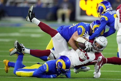 American football players battle for the ball during a game