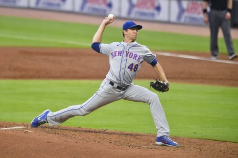 Baseball player delivers a pitch during a baseball game