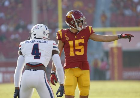 Two American football players in action during a NCAA football game