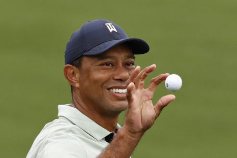 Tiger Woods practices at the practice range