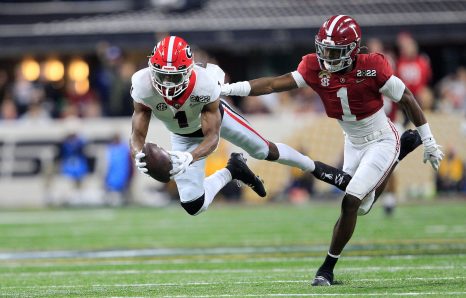 American football player scores a touch down during the game