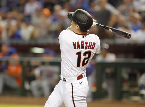 Baseball player hits a ball during a baseball game