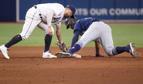 Baseball player slides into one of the bases during a baseball game