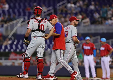 Baseball manager takes the ball from his baseball player