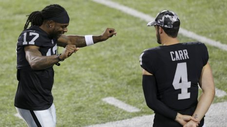 American football player celebrates a winning by dancing