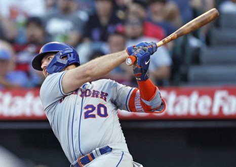 Baseball player hits the ball during a baseball game