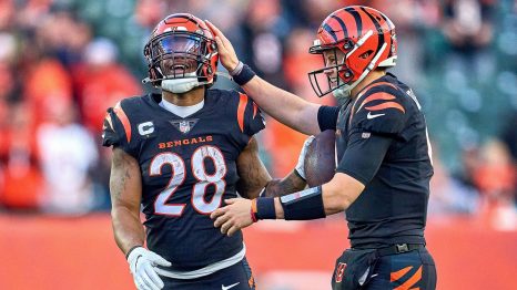 Two American football players celebrate a winning