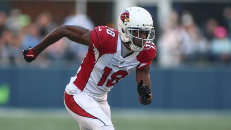 American football player runs during a match