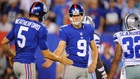 Two American football players clap the hands