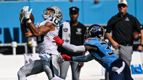 American Football player catches the ball during a match