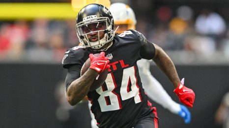 American football player runs to a touch down during a match