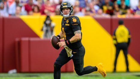 American football player throws the ball during a match