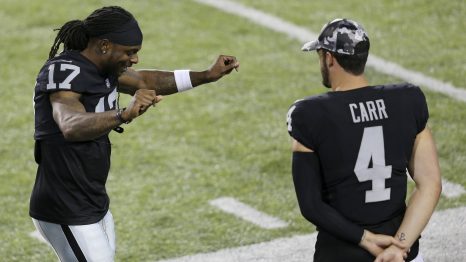 American football player celebrates by dancing a winning