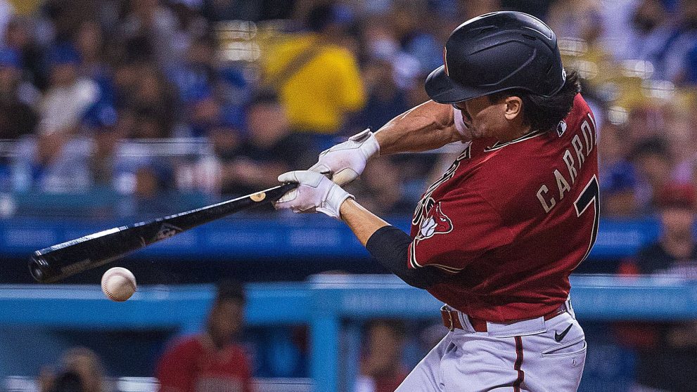 Baseball player hits the ball during a baseball game