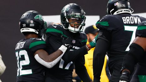 American football players celebrate after scoring during a match