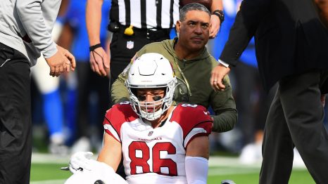 American football player with his trainer